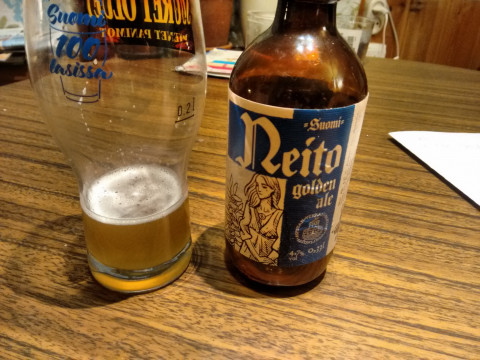 Neito Golden Ale poured from a bottle